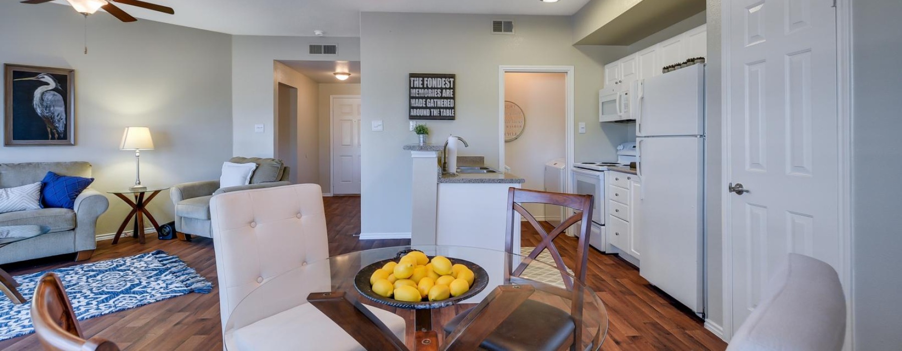 a living room with a table and chairs